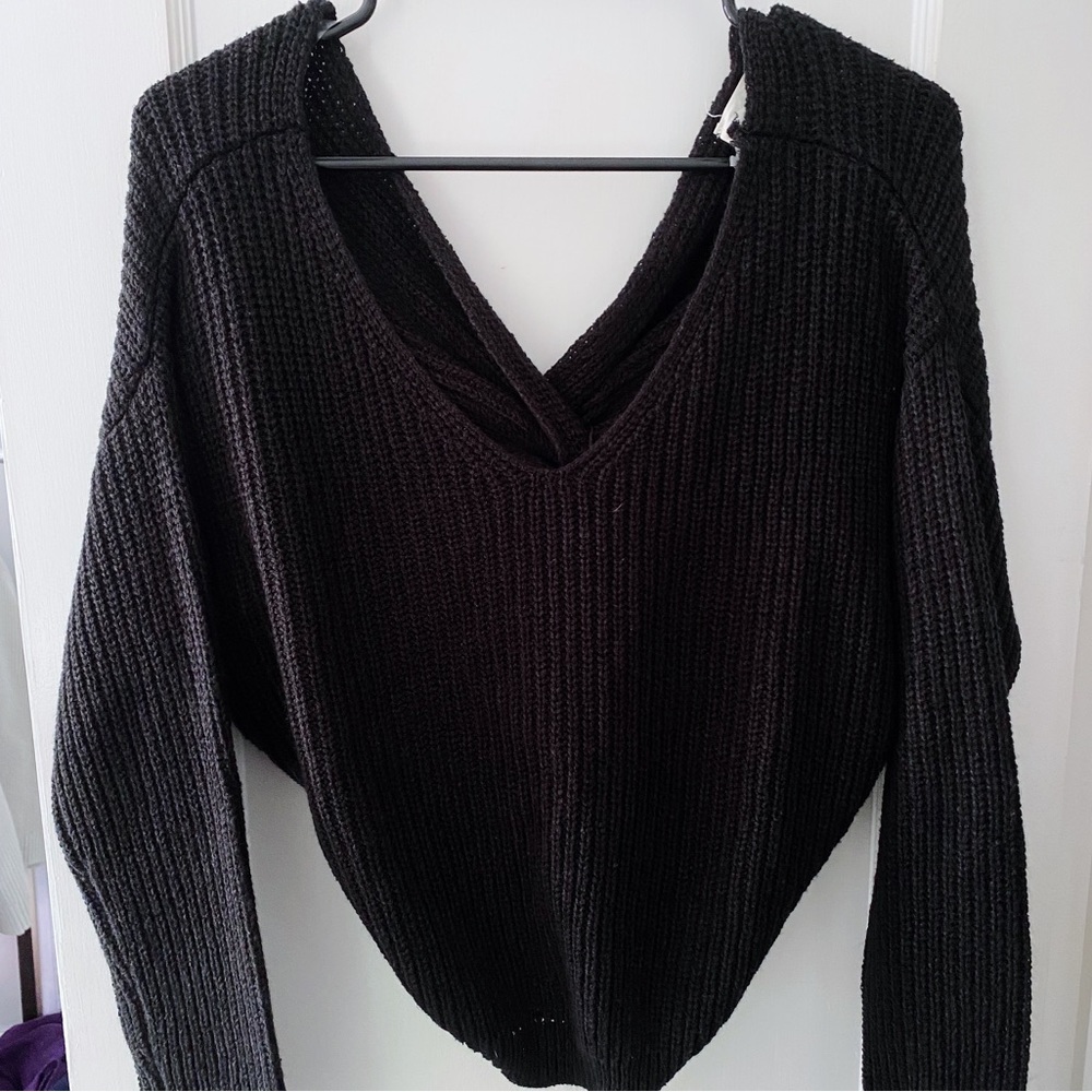 Francesca’s black sweater